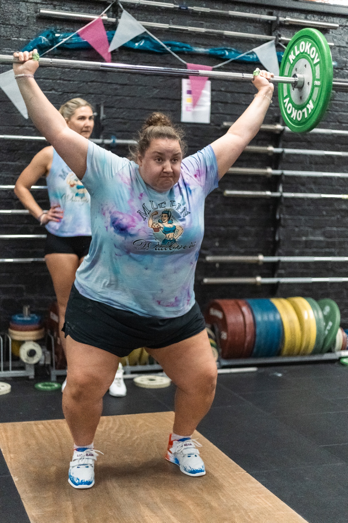 Member locking out a snatch overhead at CrossFit Lifeline Epsom